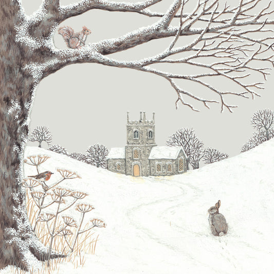 An illustrated card by Sally Swannell of an old country church across a snowy field, overlooked by a red squirrel, robin and rabbit.