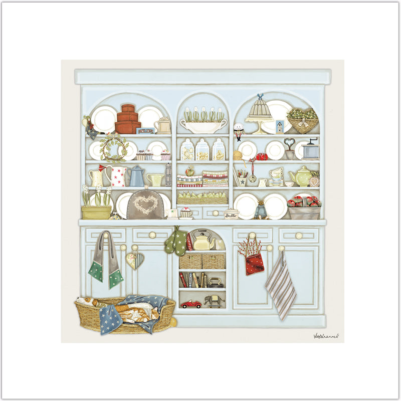 A Giclee print depicting a country kitchen dresser filled with various household items such as books, a cake stand, and a teapot, there is a sleeping dog and cat in a basket in front.