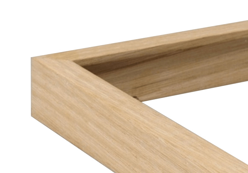 A close up of a corner of a wood frame.