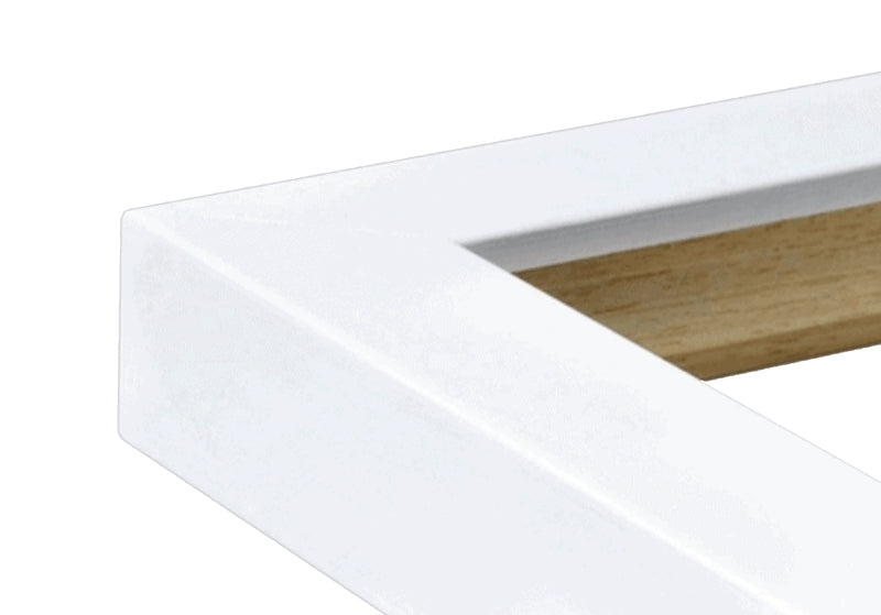 A close up of the corner of a white frame.