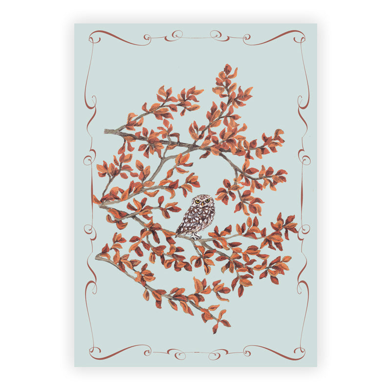 Card with an owl on a branch and decorative border on a light blue background