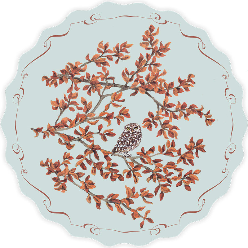 Round postcard designed by Sally Swannell  with an owl and branch design on a light blue background