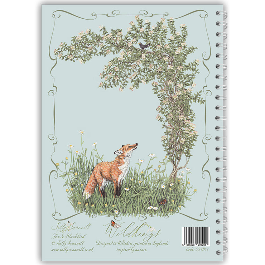 Notebook with a fox and blackbird illustration on a light blue background