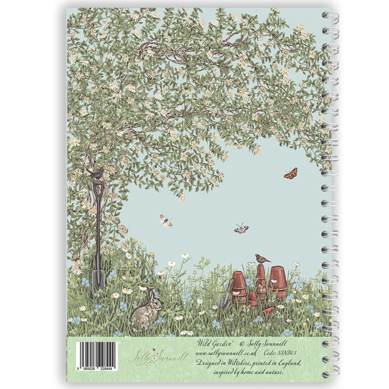 Notebook with a garden scene design featuring trees, flowers, and animals on the cover.