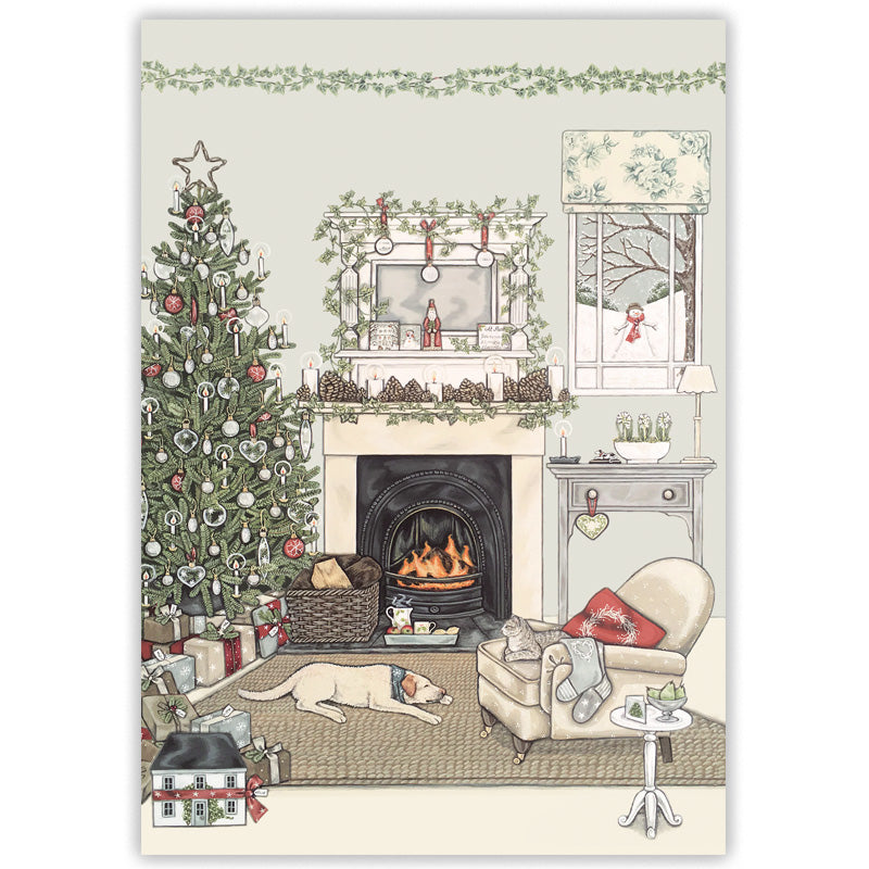 A vintage-style Christmas card showing a cozy living room with a decorated tree, burning fireplace, window view of snow, armchair, stockings, and a sleeping dog on a rug and cat sat in a chair.