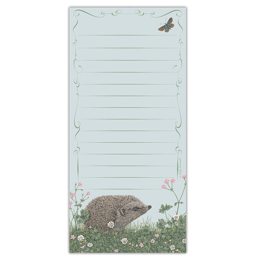 A jotter pad with an illustration of a hedgehog amongst cranesbill and white clover flowers, a butterfly in the top right. Page is lined with an ornate border design.