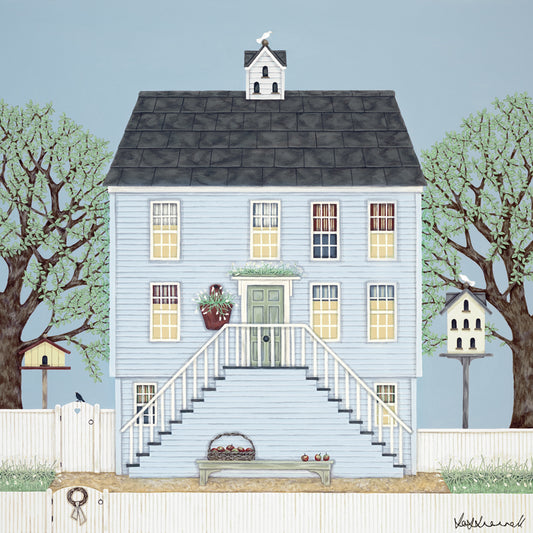 A giclee print featuring a blue clapboard New England-style house with a slate roof, flanked by trees. Stairs running up to the front door, a dovecote and birdhouse in the garden, white picket fence surrounding.