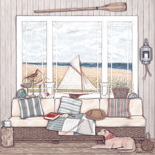 A giclee print featuring a view on to a beach from a lovely clapboarded room containing a wicker sofa, model sailboat, decoy ducks, storm lanterns, sea lavender and a dog lying on the floor.