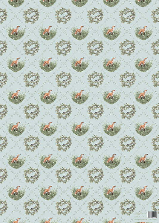 Patterned gift wrap with foxes, blackbirds and wreaths on a light blue background
