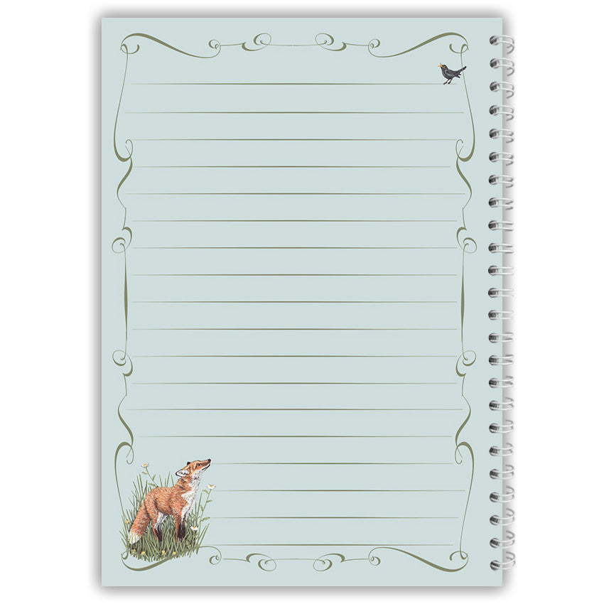 Notepad with fox and blackbird illustration on a light blue background