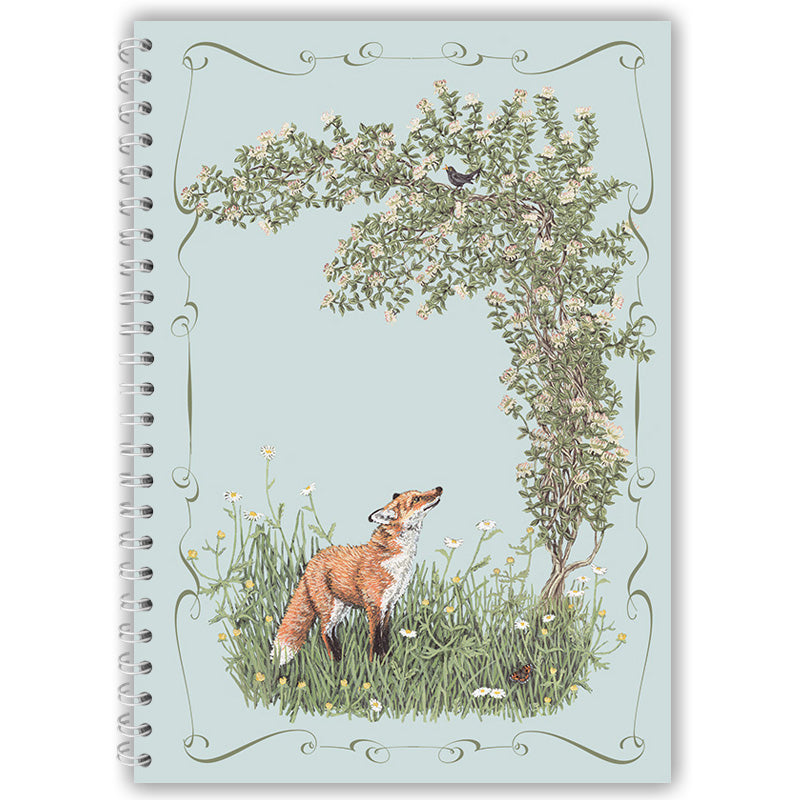 Notebook cover with a fox and blackbird illustration on a light blue background