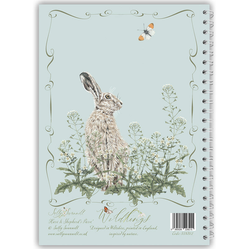 Notebook with a hare and wild flower illustration on a light blue background