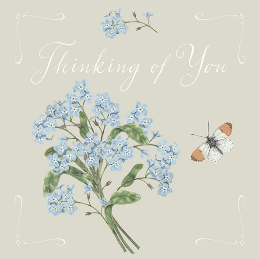Greetings card with forget me nots and an orange tip butterfly on an off white background with 'Thinking of You' text.