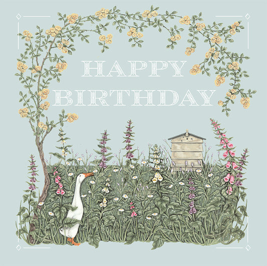 A pretty illustrated birthday card depicting a runner duck and bee hive in a cottage garden.