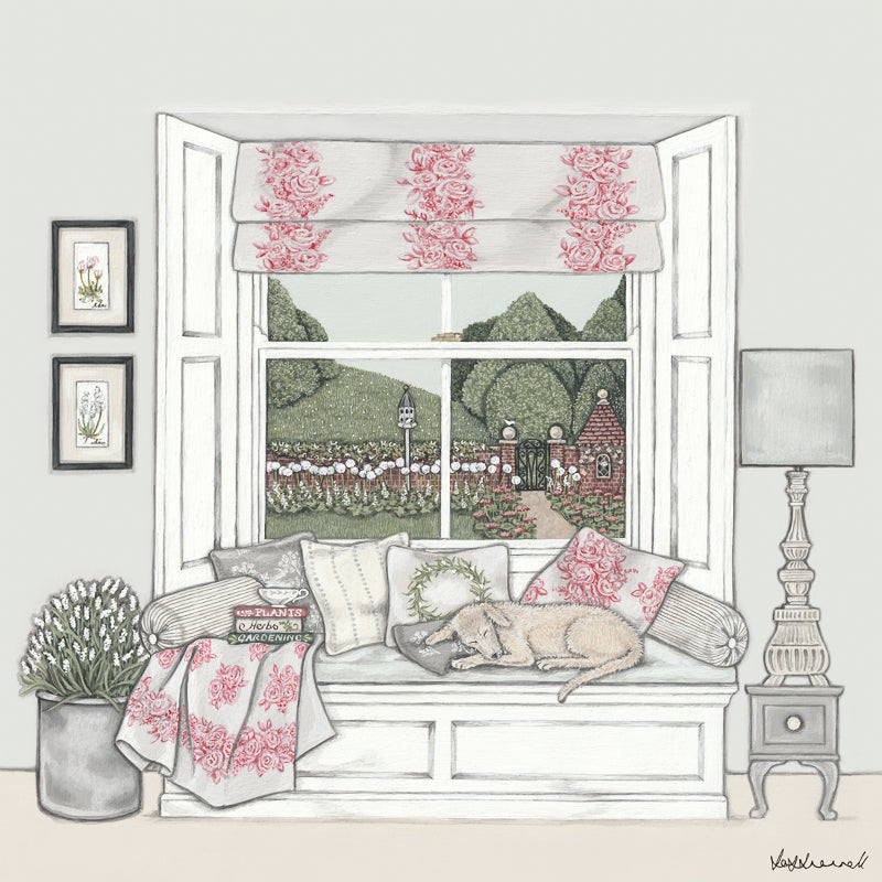 Giclee print of a window seat set in a bay sash window, topped with cushions, and a sleeping dog. Pictures on the wall, a large flower arrangement, side table, lamp, books and cup of tea in the room. The window overlooks countryside, a walled garden containing alliums and a dovecote.